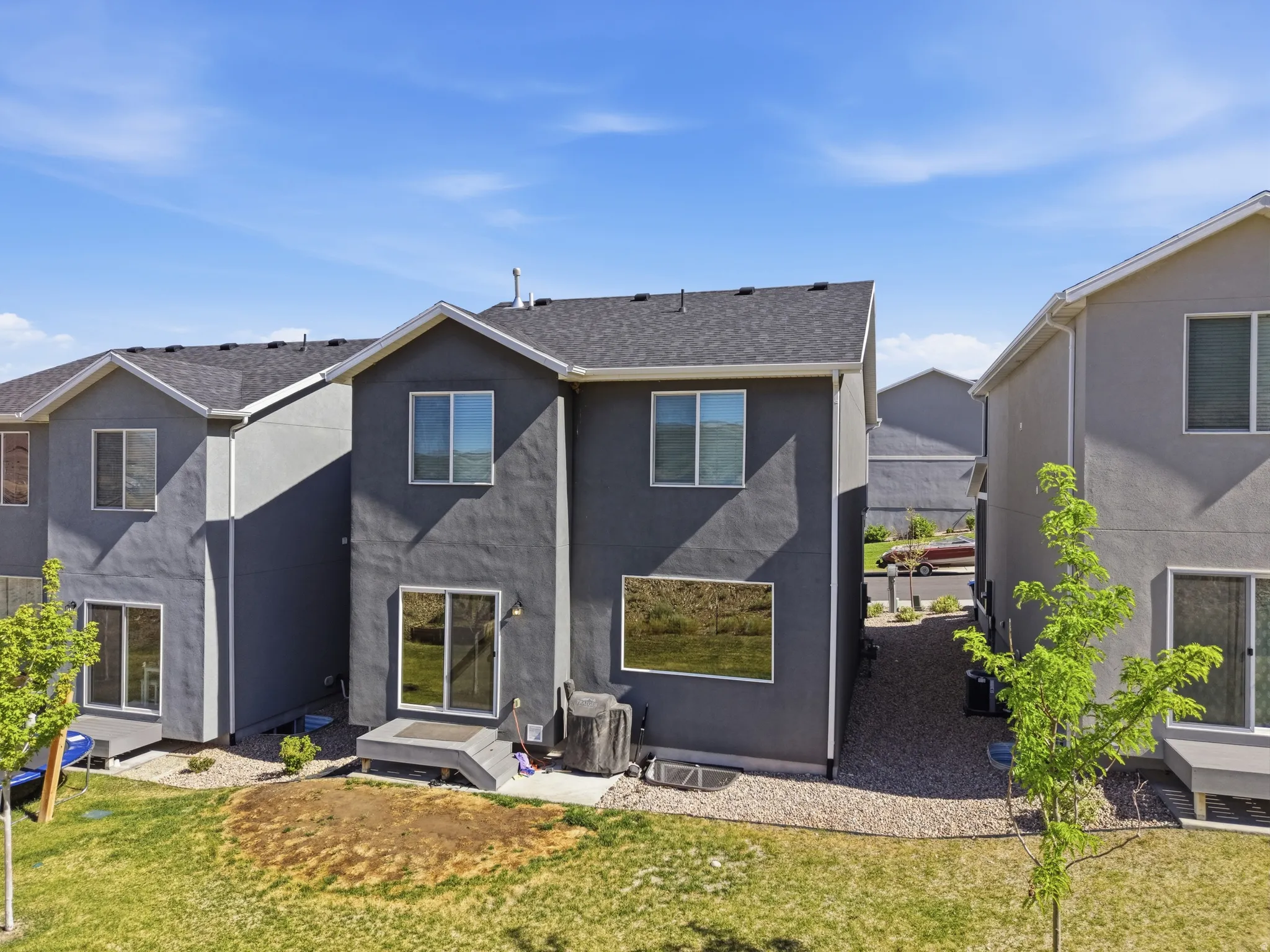 Exterior stucco finish with a dark gray color scheme