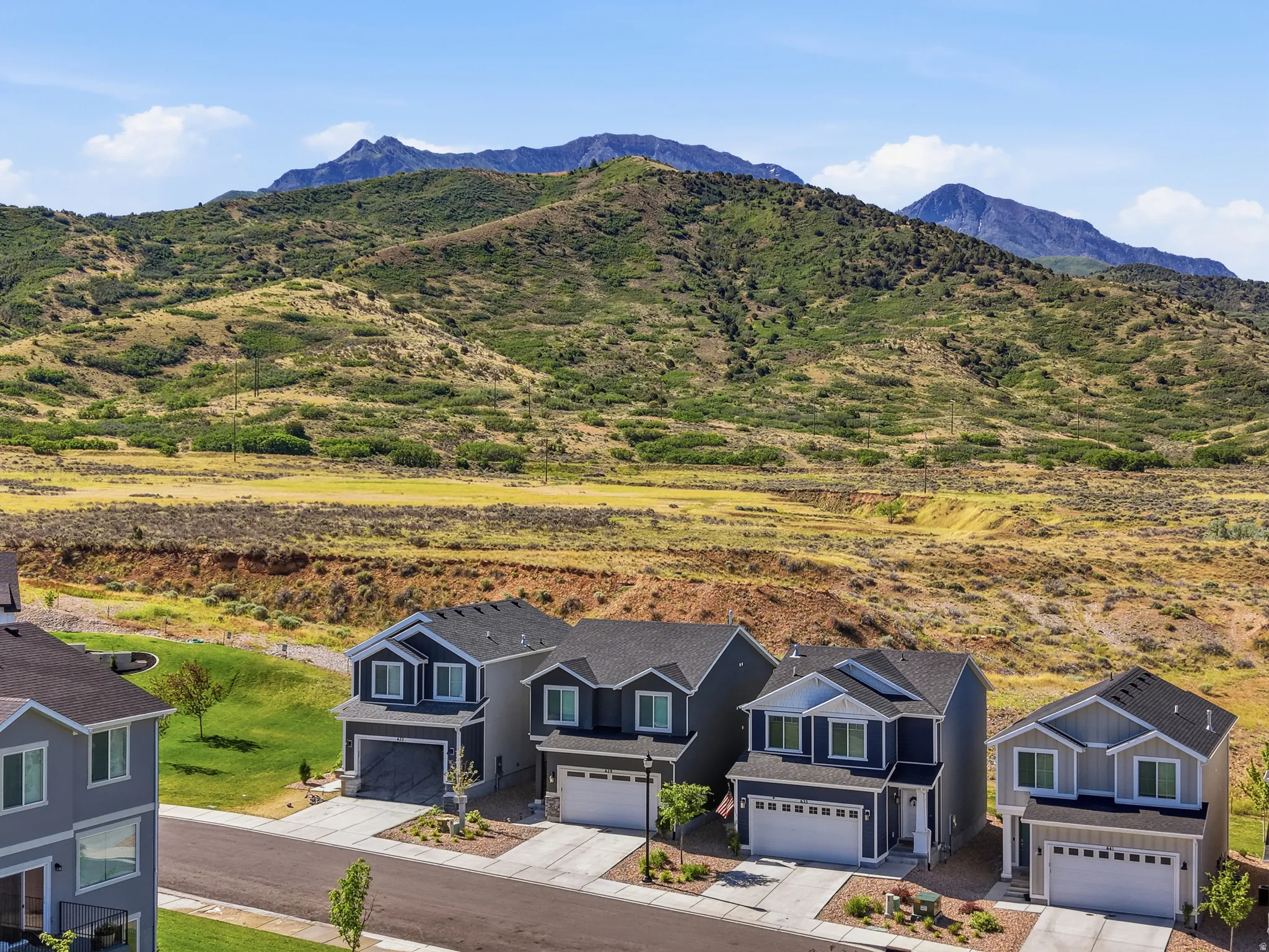 Modern suburban architecture with a mountain backdrop