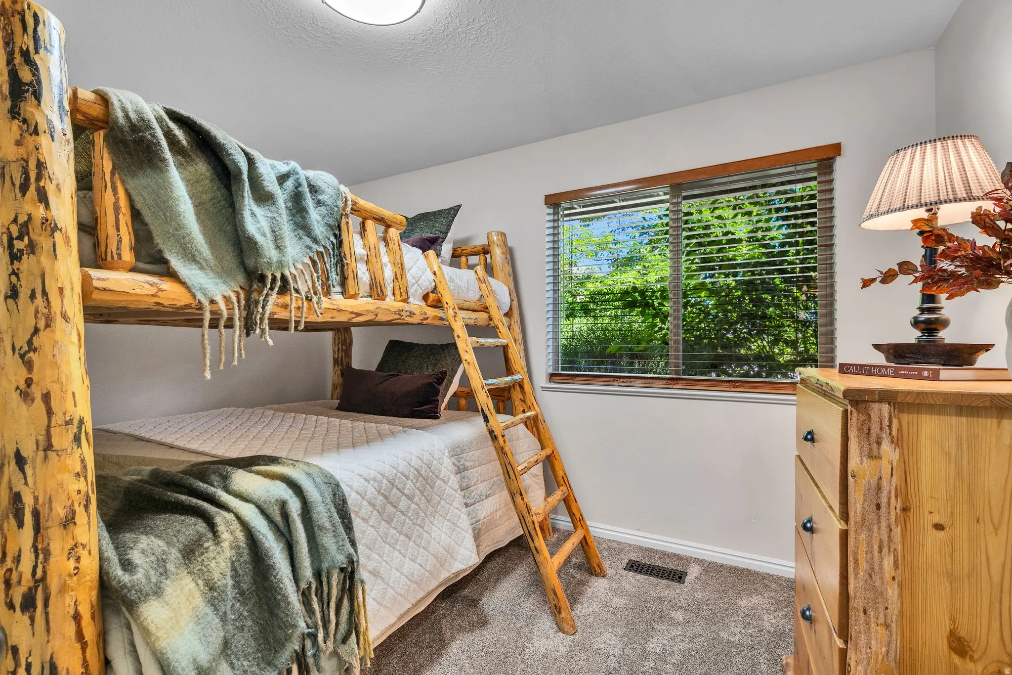 Rustic wood bunk beds with integrated ladder
