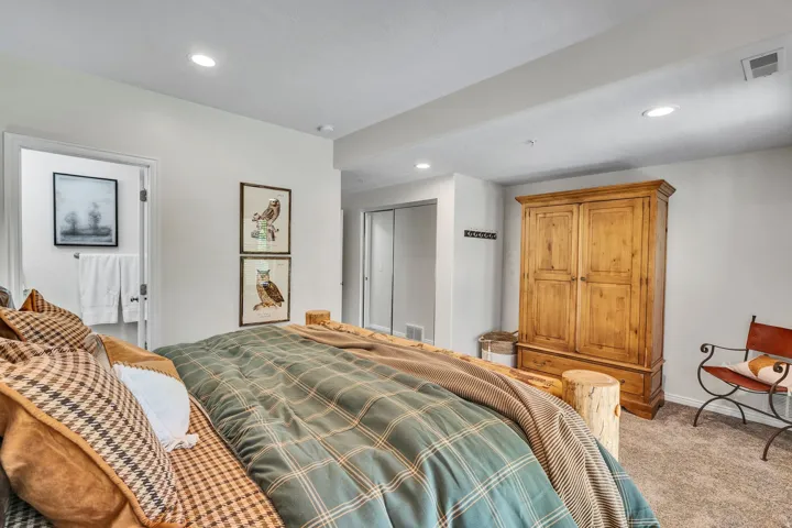 Bedroom featuring plush carpet, recessed lighting, and a neutral color palette