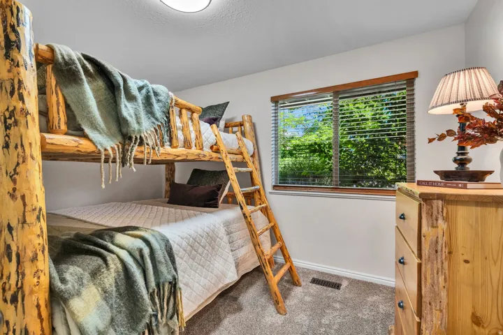 Rustic wood bunk beds with integrated ladder