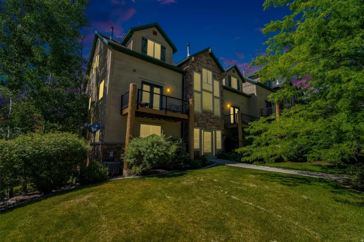 Multi-level property with a stone and siding exterior