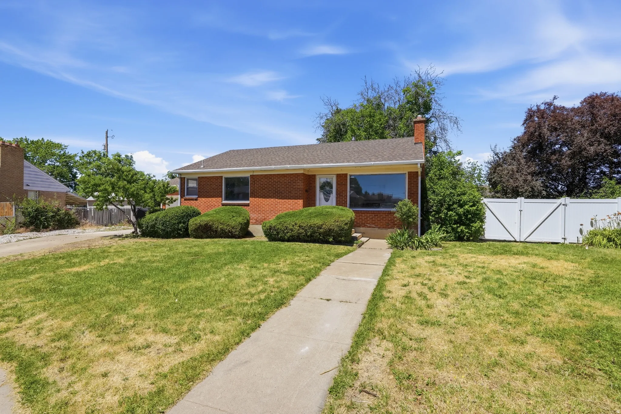 Brick exterior with a gabled roof and a prominent front window