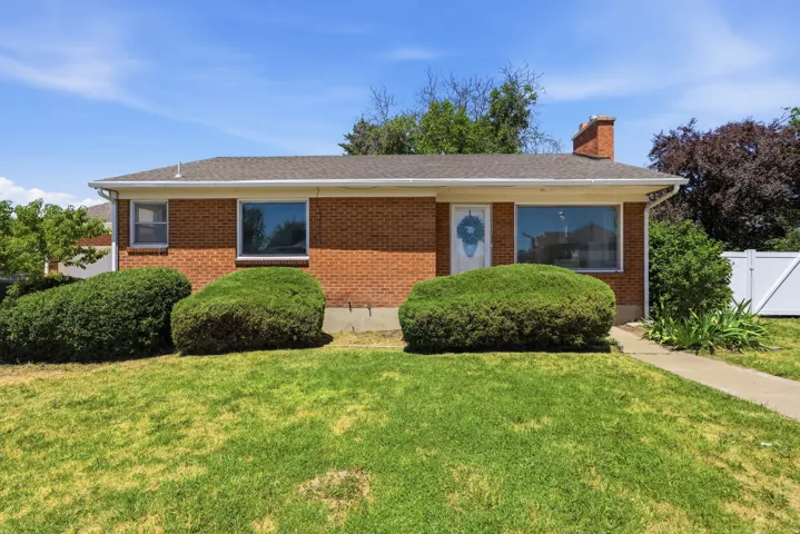 Brick exterior with a gabled roof and white trim