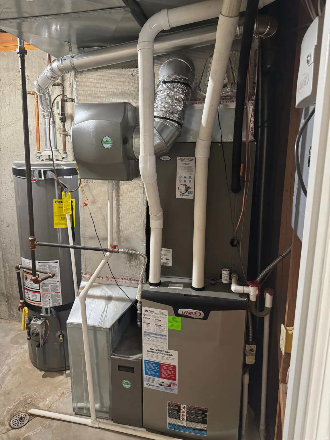 Comprehensive HVAC system featuring a Lennox furnace, water heater, and an attached humidifier
