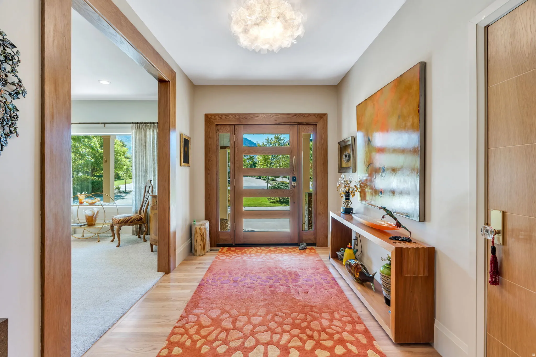 Entryway featuring light wood-finish flooring and a glass-paneled front door