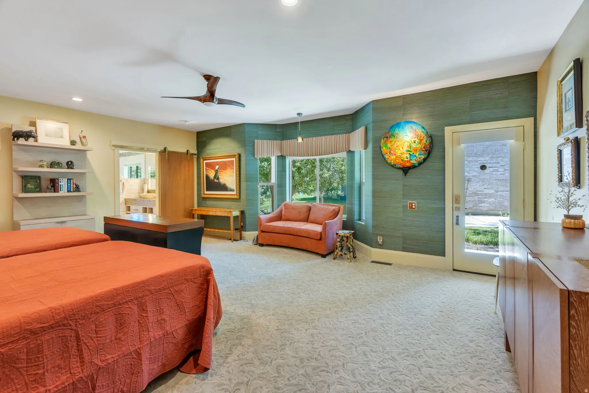 Carpeted room featuring a ceiling fan, recessed lighting, and a window with a valance