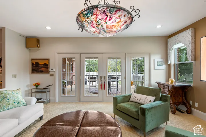 French doors with glass paneling, recessed lighting, and a decorative ceiling fixture