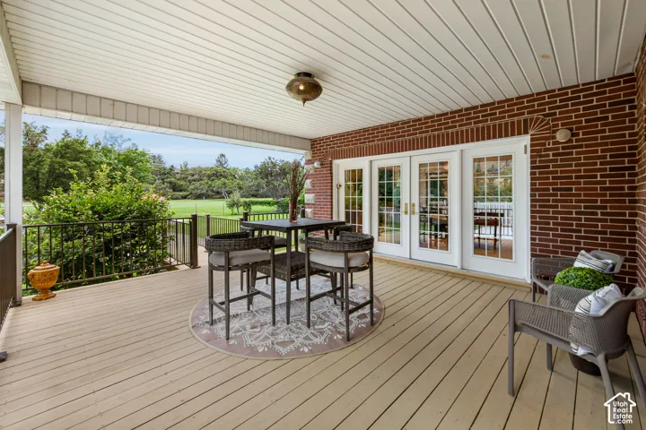 main floor Back patio leads out to pool and jacuzzi