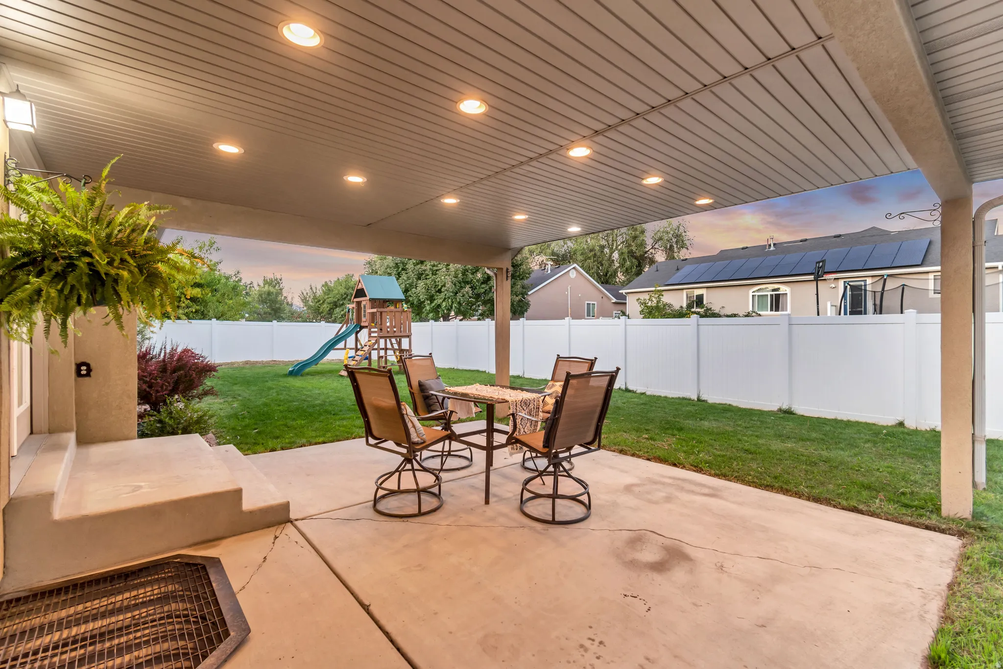 Covered patio with recessed lighting and concrete flooring