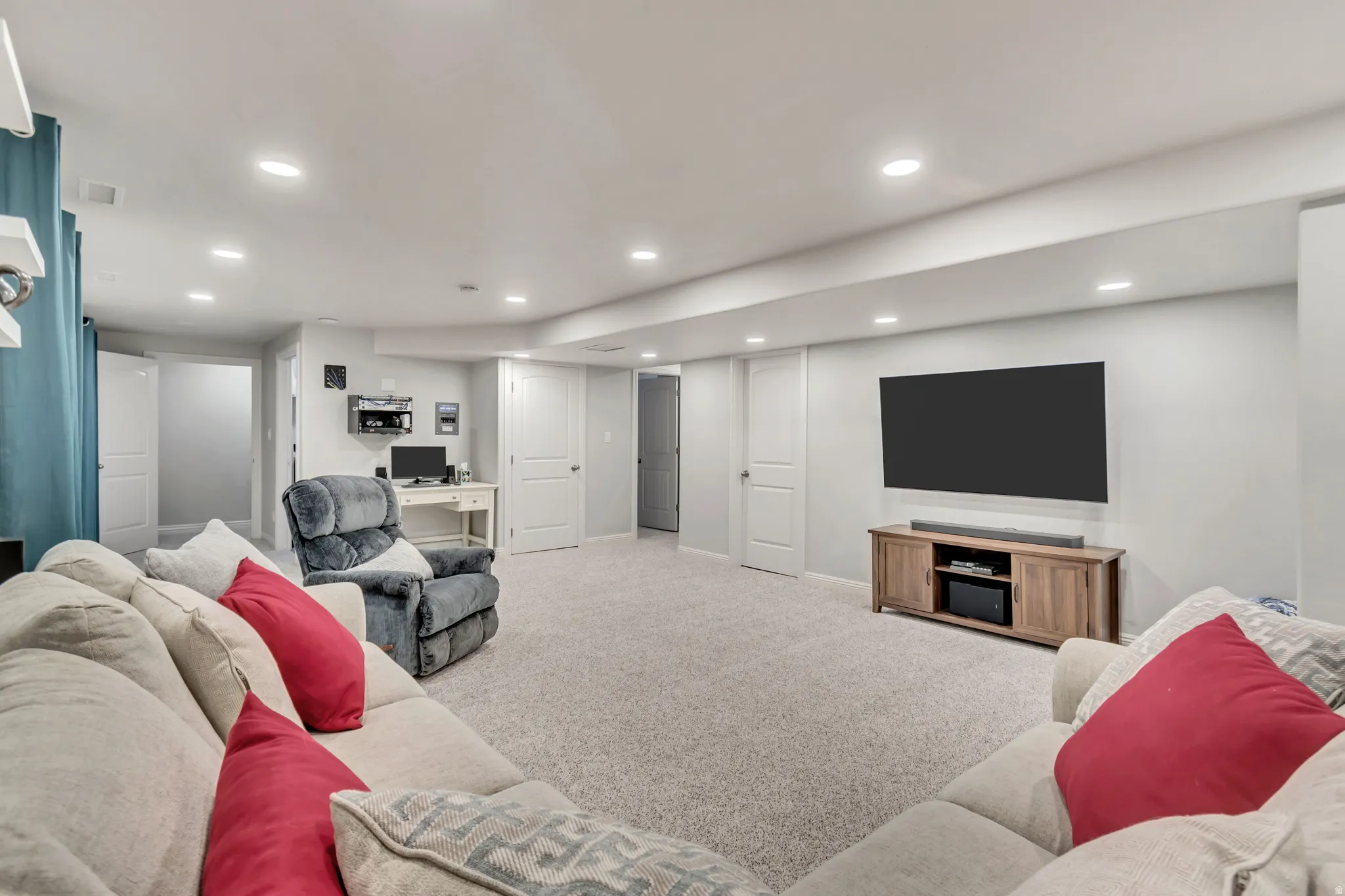 Spacious finished lower level featuring recessed lighting and light gray wall paint
