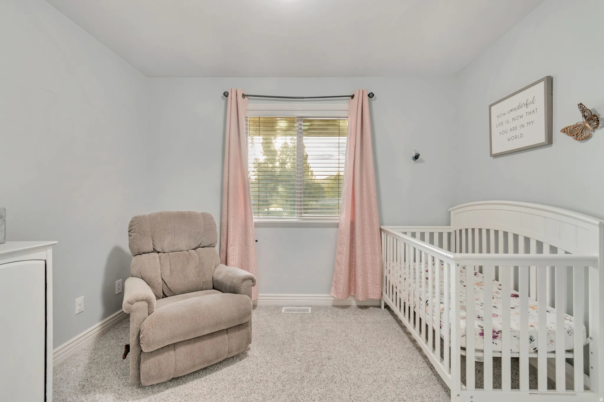 Room featuring light gray walls, plush gray carpeting, and white baseboards