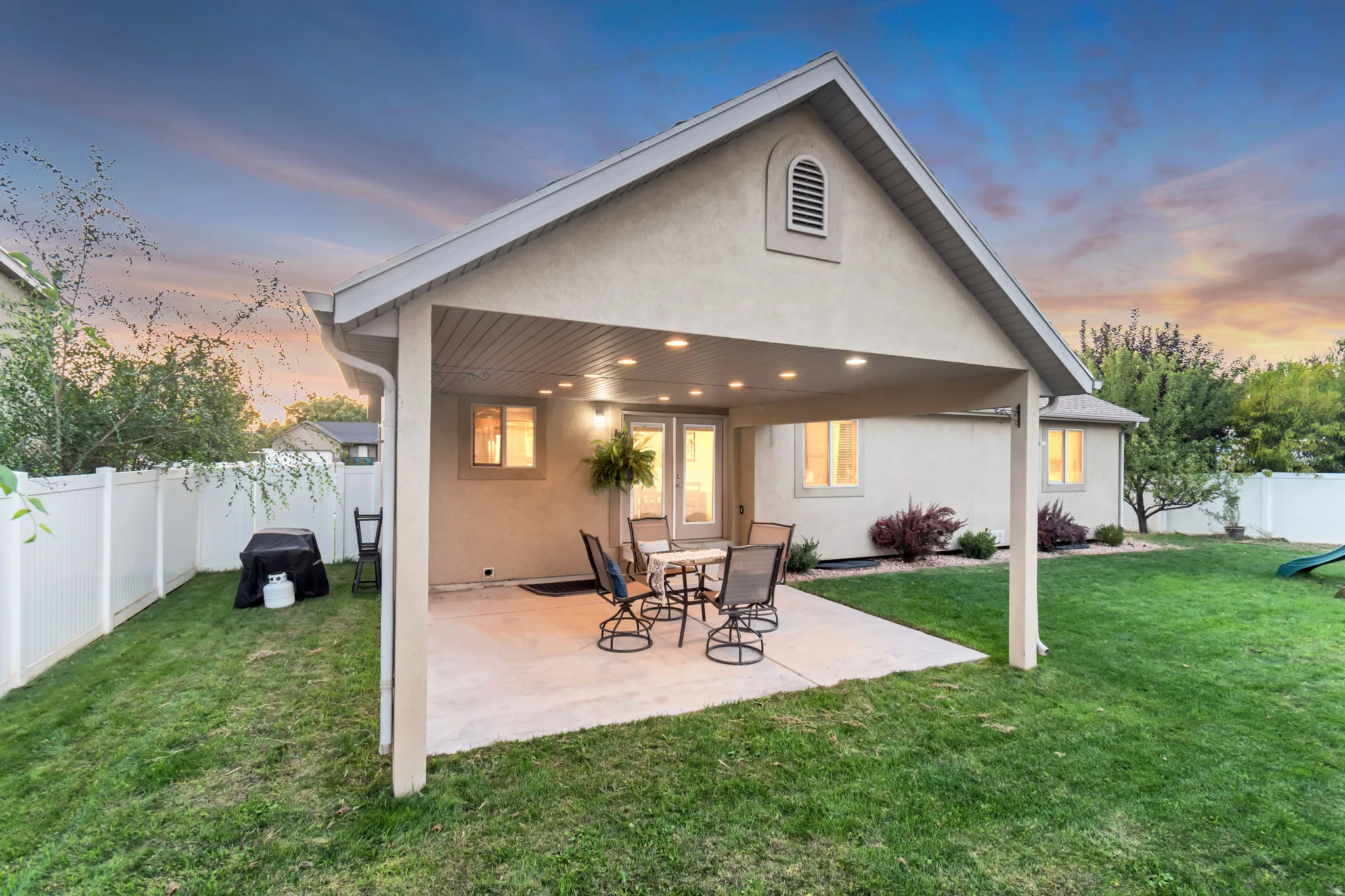 Covered patio featuring recessed lighting, stucco exterior, and dual-pane windows