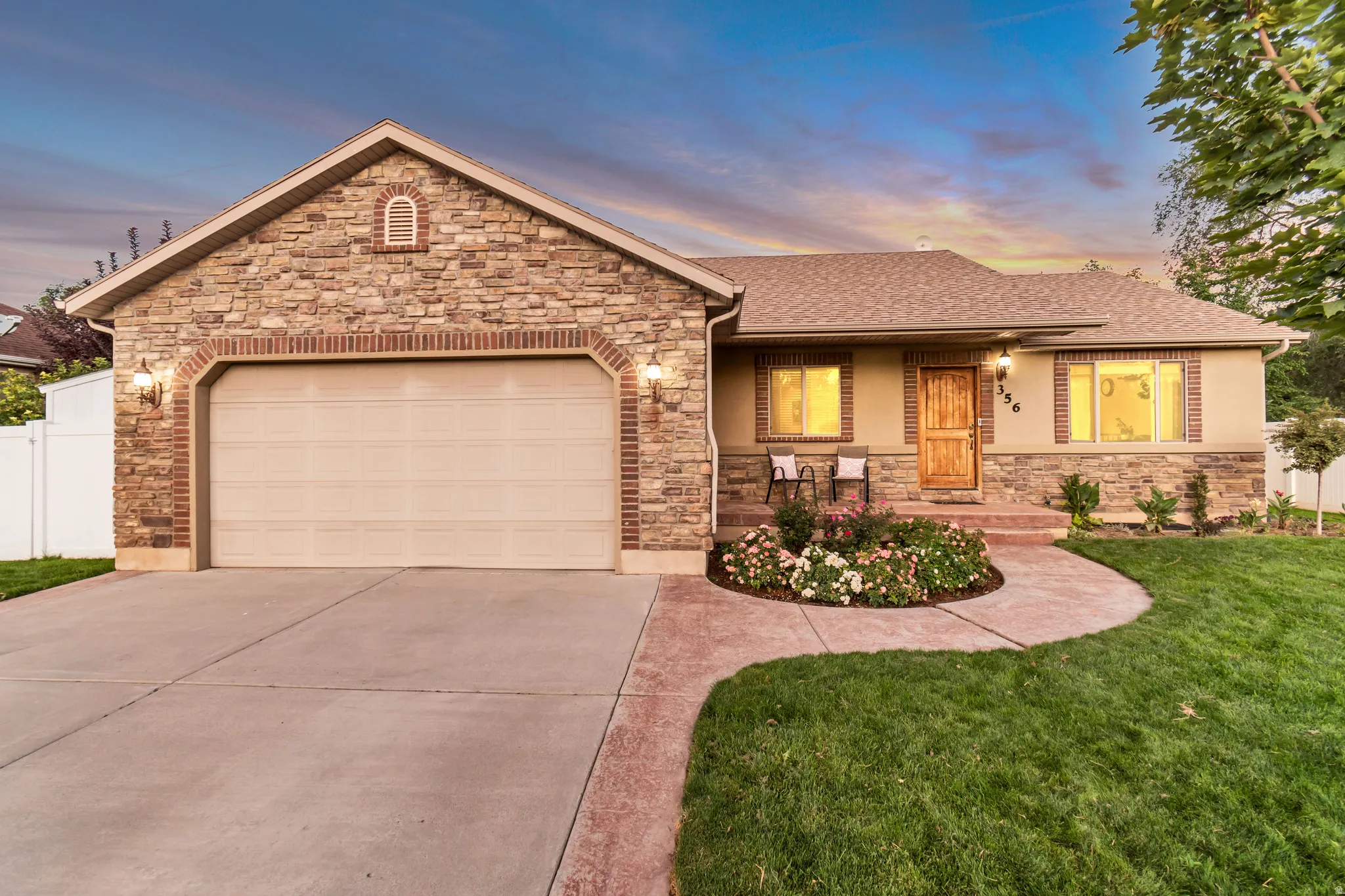 Stone and stucco exterior with brick accents