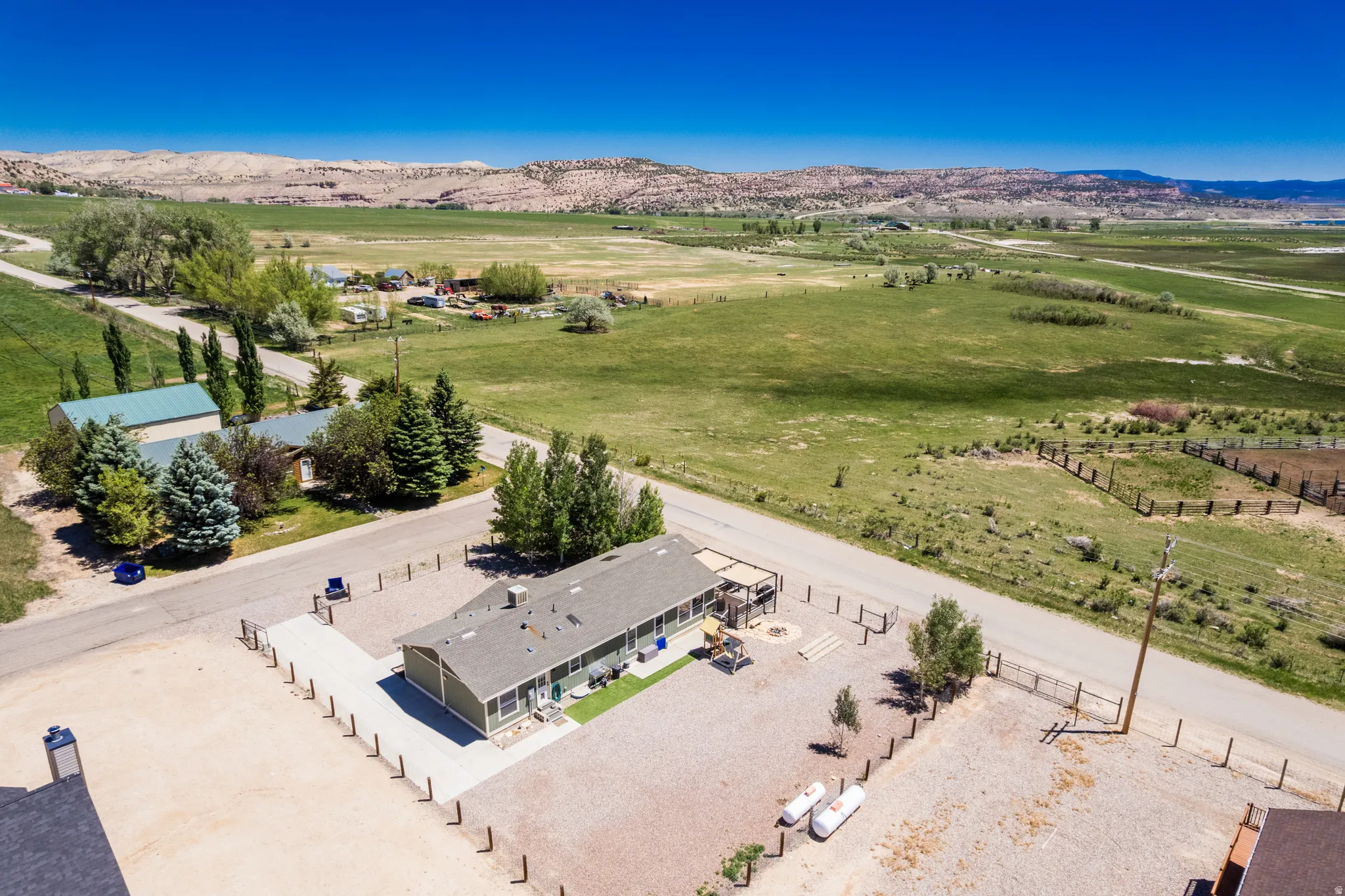 Spacious property featuring an extended single-story residence with an attached covered patio