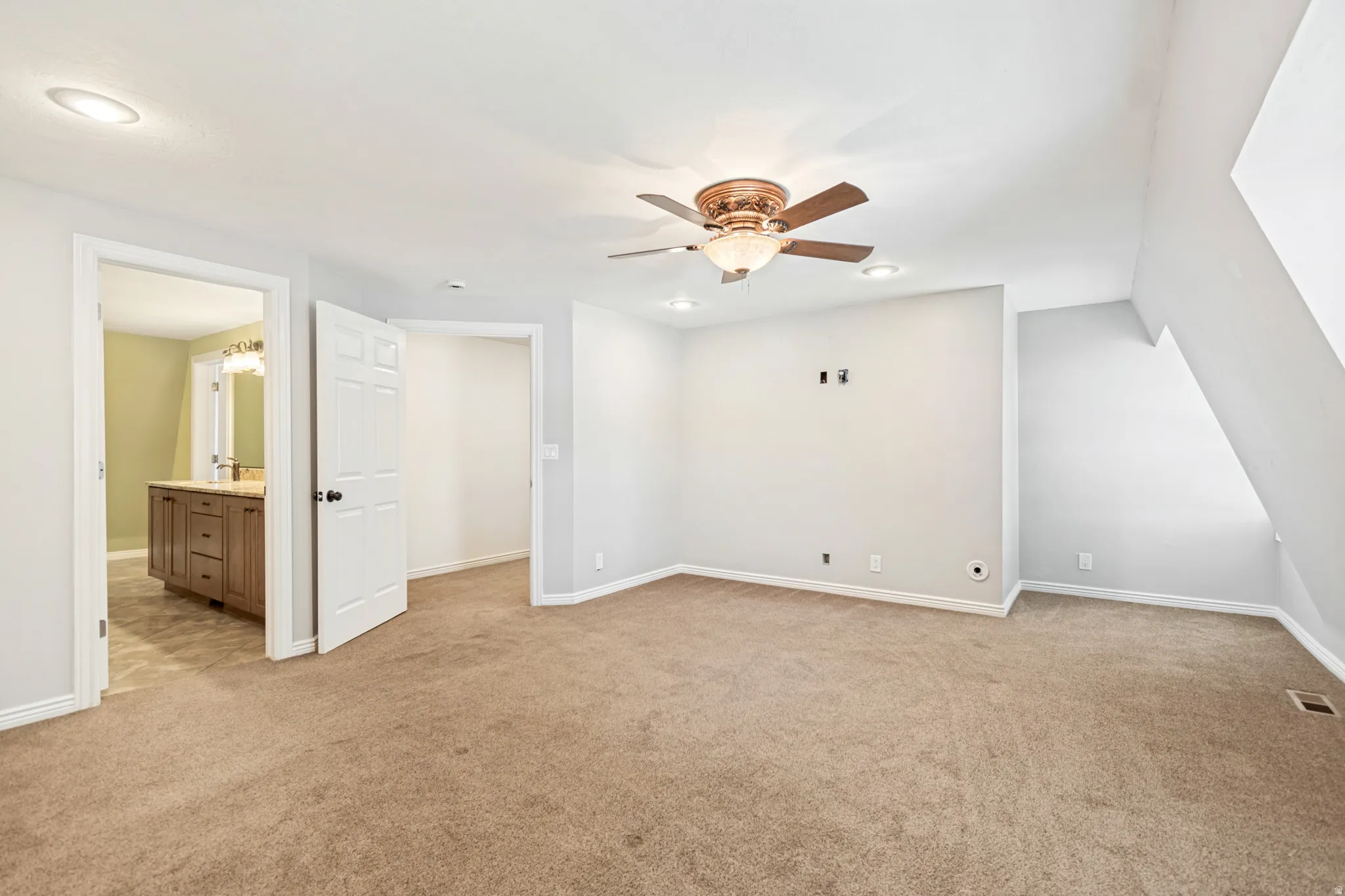 Master carpeted room featuring a ceiling fan with integrated lighting, recessed lighting, and a neutral color palette