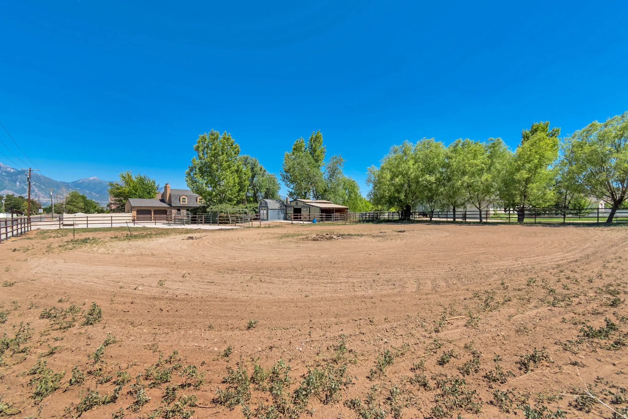 Expansive outdoor arena featuring a dirt surface