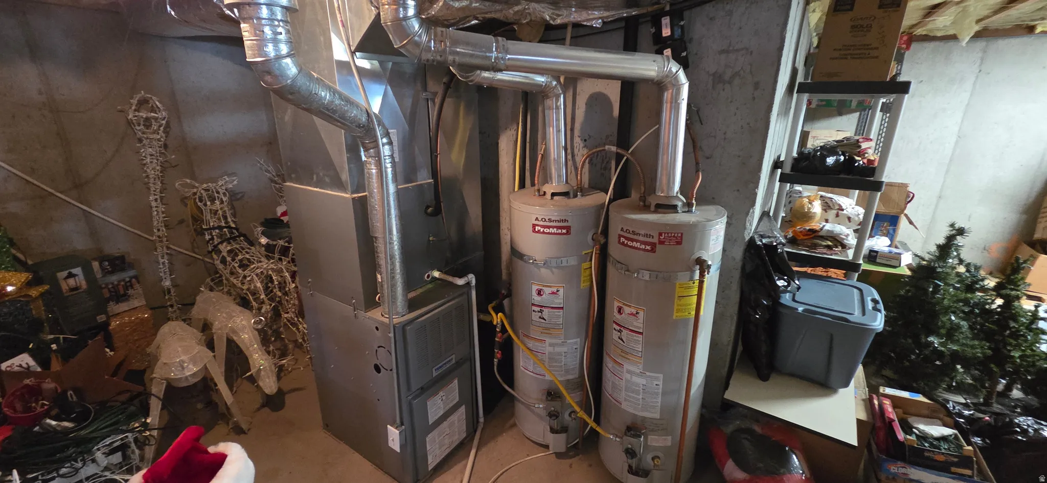 Dual hot water heaters and a central furnace system