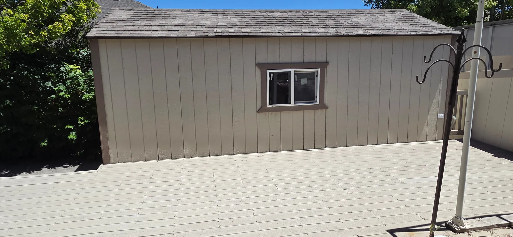 Exterior deck constructed with composite materials, detached shed for storage/shop area