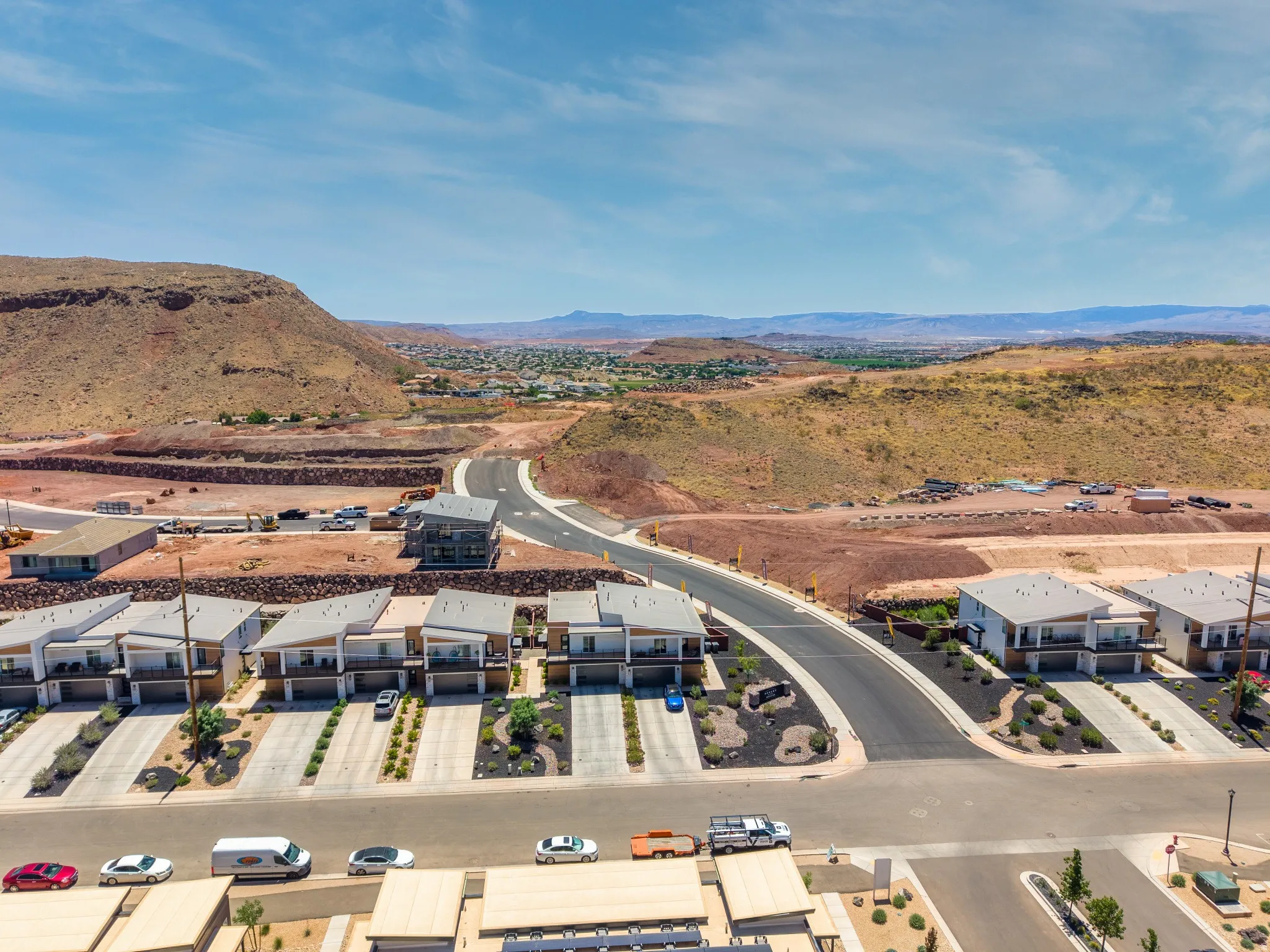 Modern residential development featuring multi-level units with integrated garages