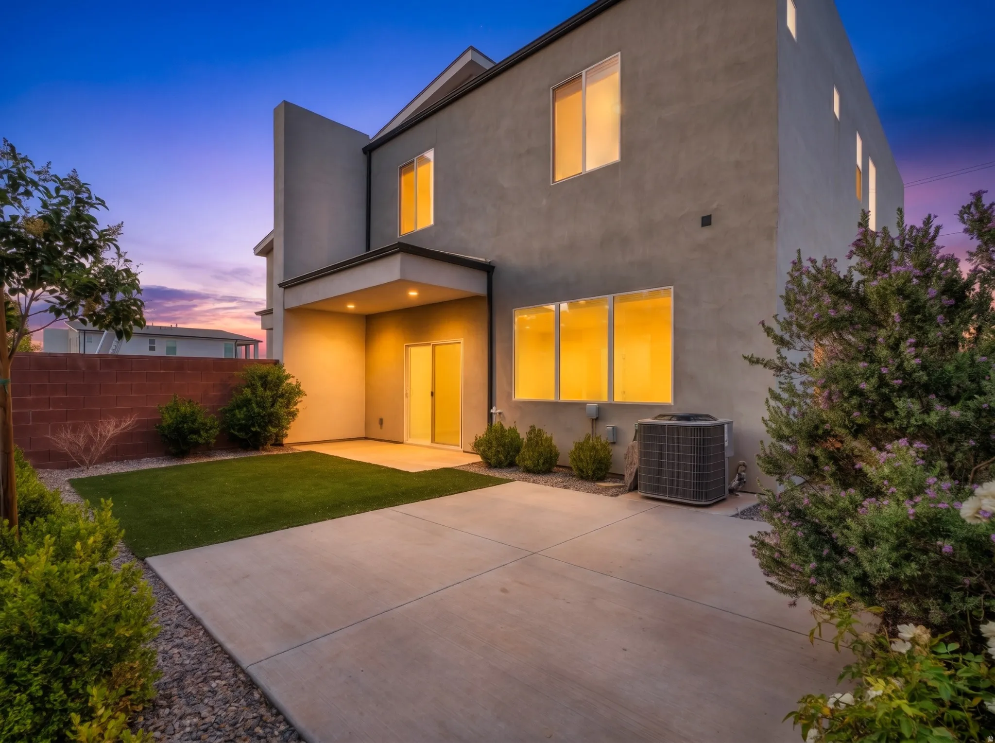 Modern stucco exterior with multiple windows