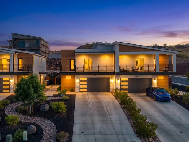 Modern architectural design featuring a white facade with horizontal wood-finish siding accents