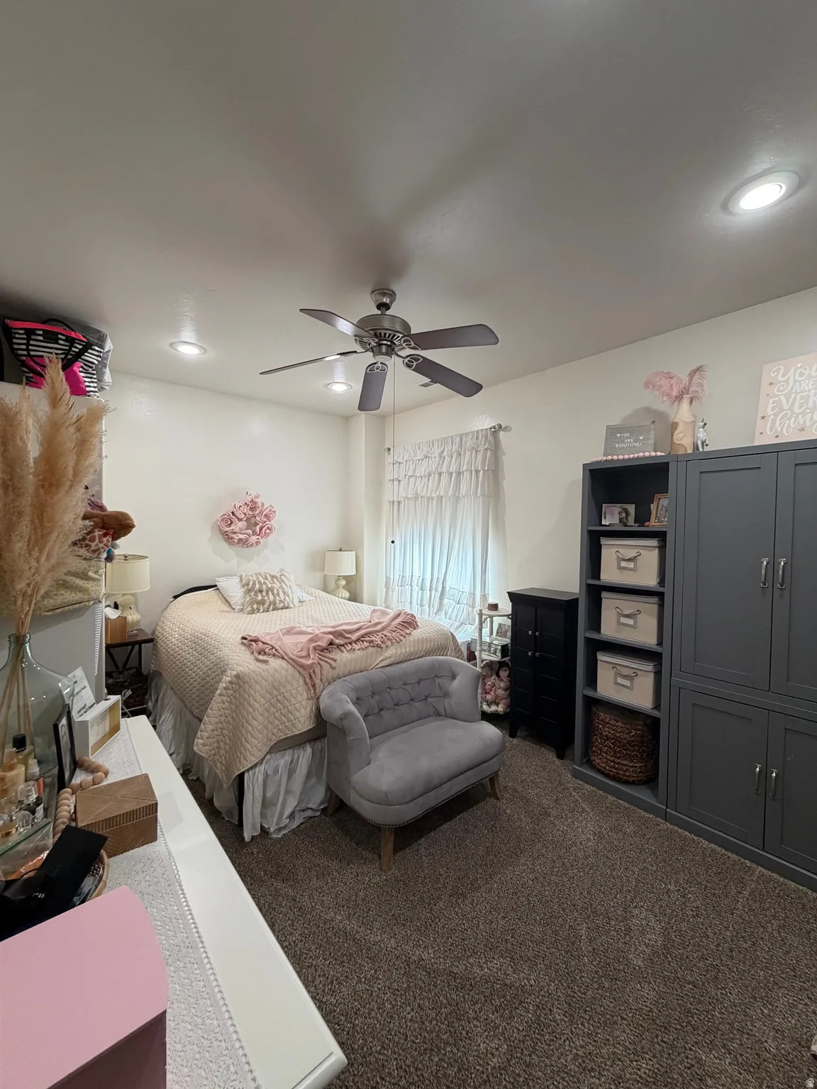 Carpeted interior room featuring recessed lighting and a ceiling fan