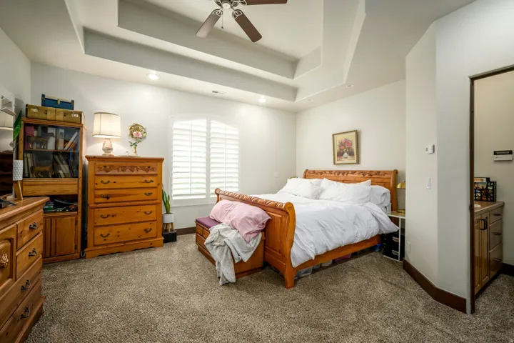 Tray ceiling with recessed lighting and a ceiling fan
