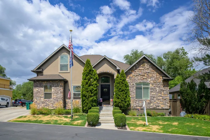 Stucco and stone exterior with arched entry