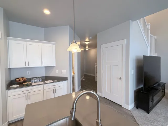 Kitchen island with integrated sink and chrome gooseneck faucet
