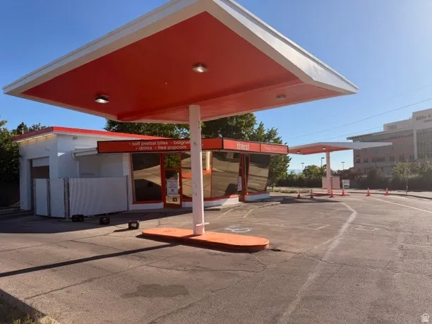 Commercial building featuring an expansive paved lot
