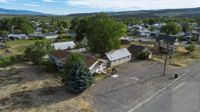 Aerial perspective showcasing multiple structures on a spacious lot