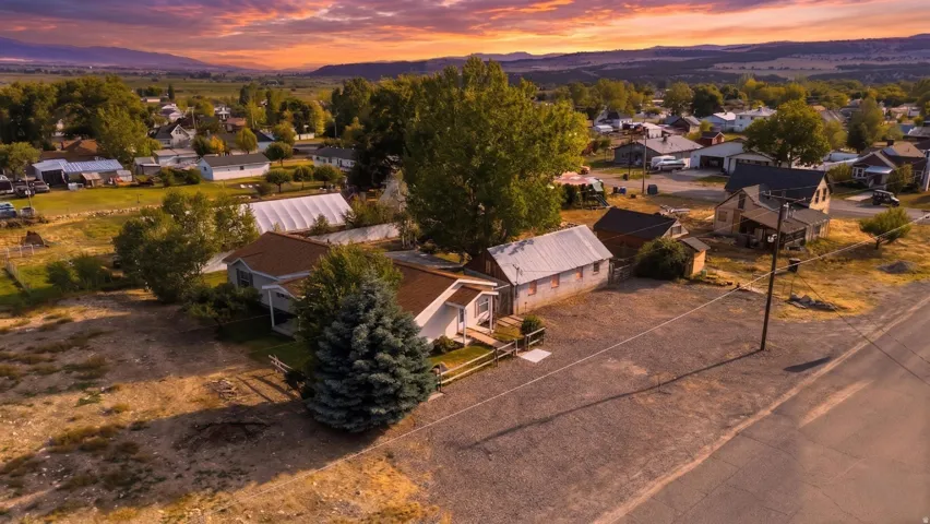 Aerial perspective showcasing multiple residential structures and neighborhood houses- land lots