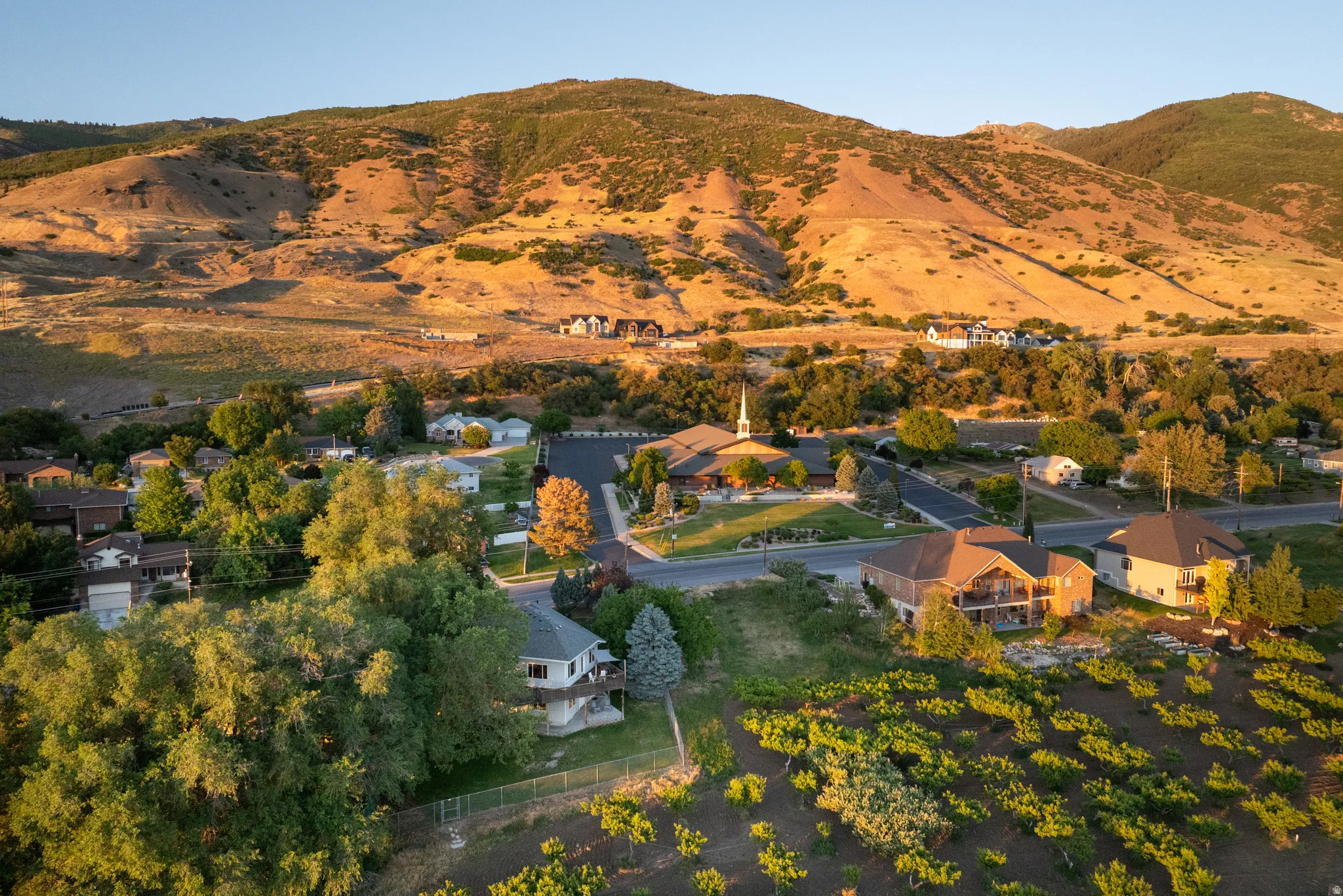 Expansive mountain backdrop framing a residential area with varied home styles