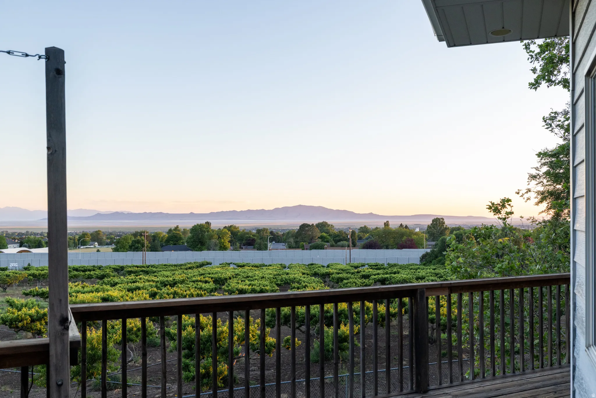 Expansive outdoor deck with wood railing