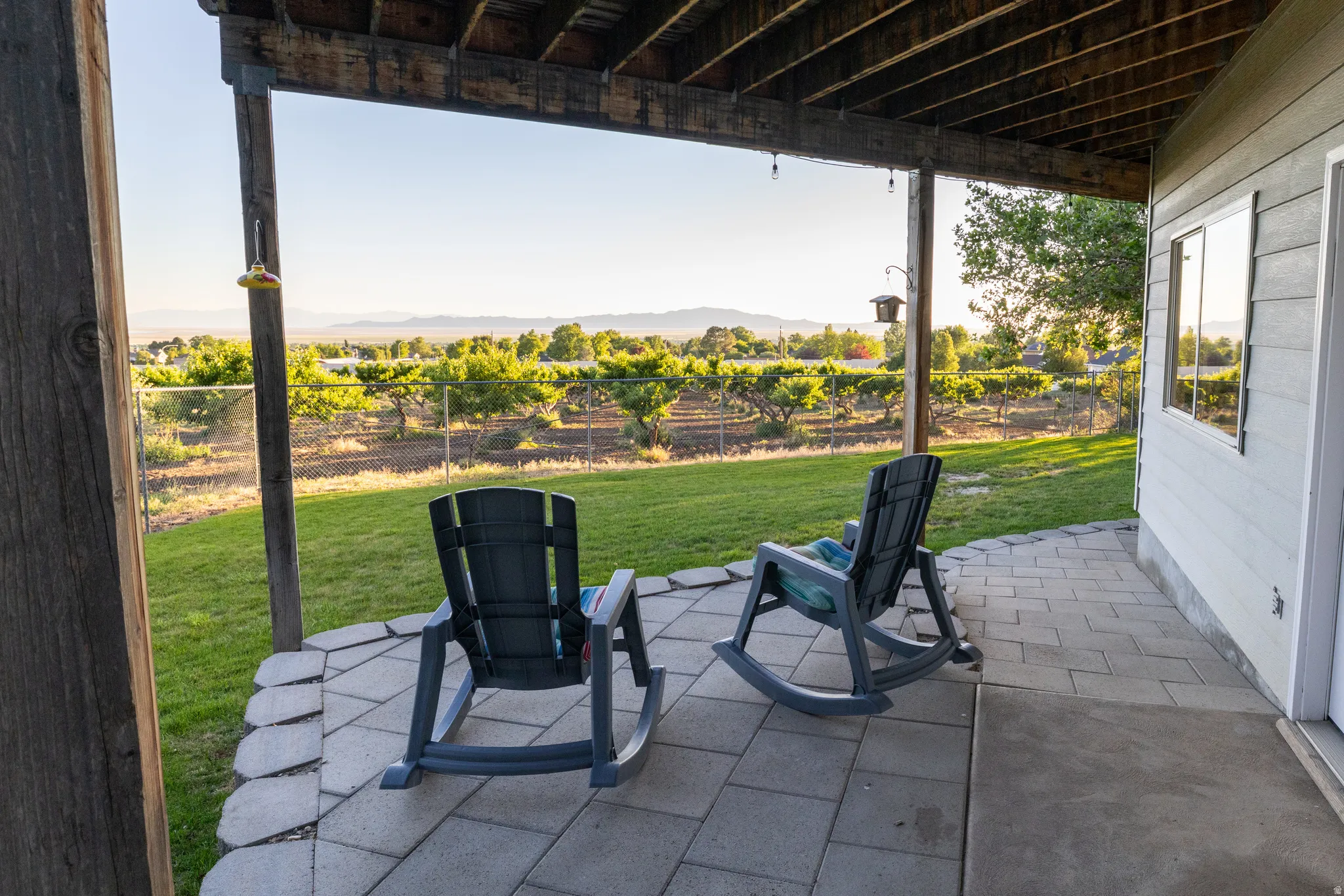 Covered patio with paver and concrete flooring