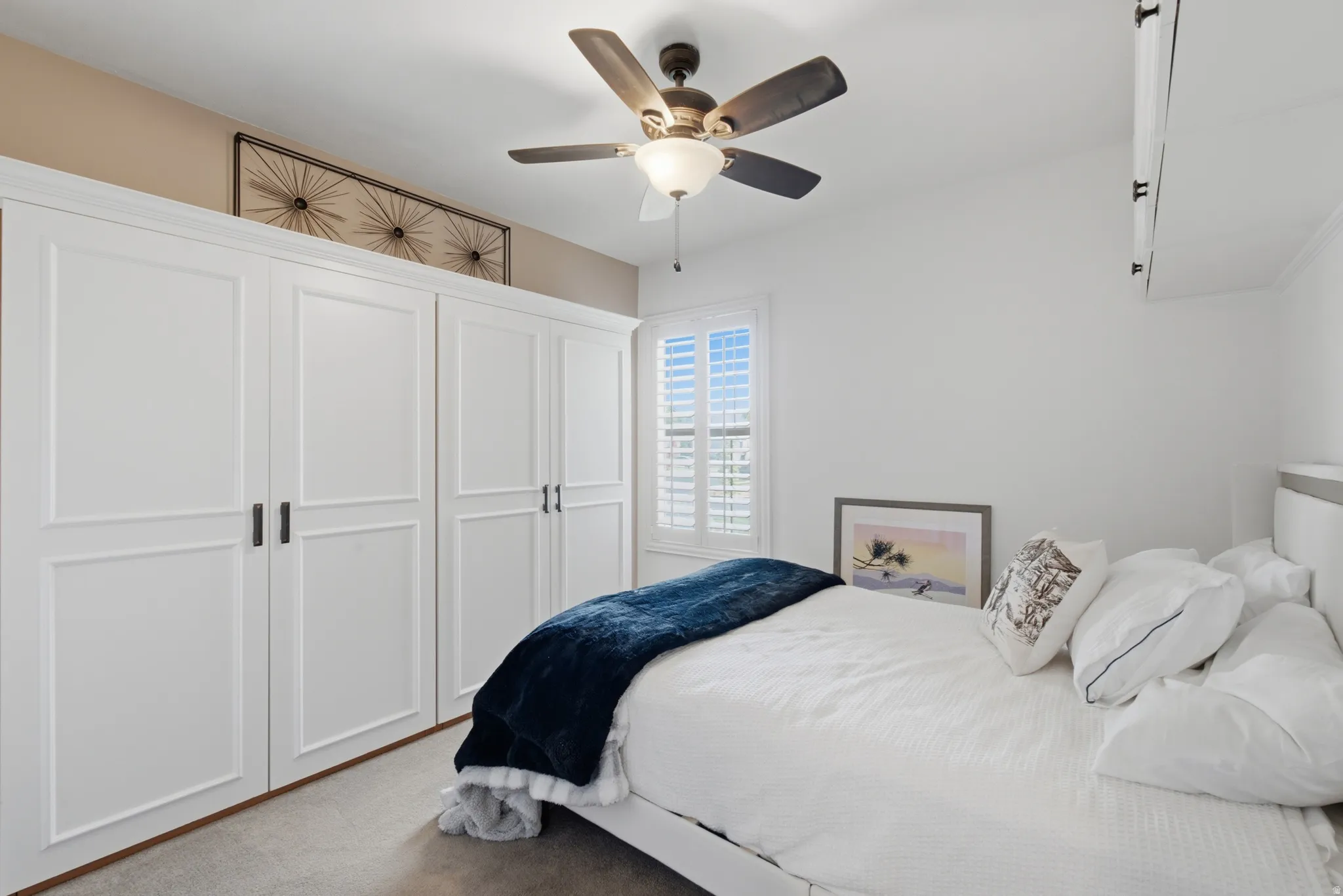 Built-in white paneled cabinetry with black hardware