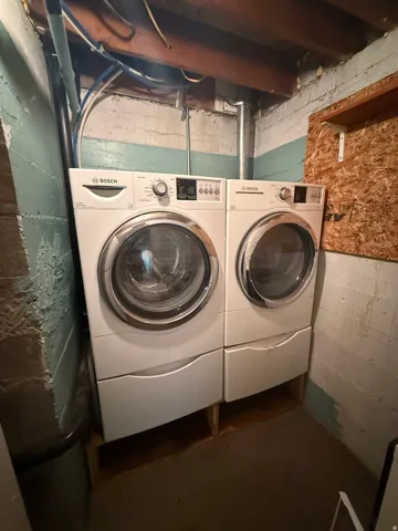Front-loading washing machine and dryer set with pedestal drawers