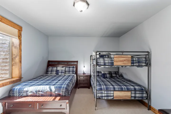 Carpeted room featuring light gray walls and a flush-mount ceiling light