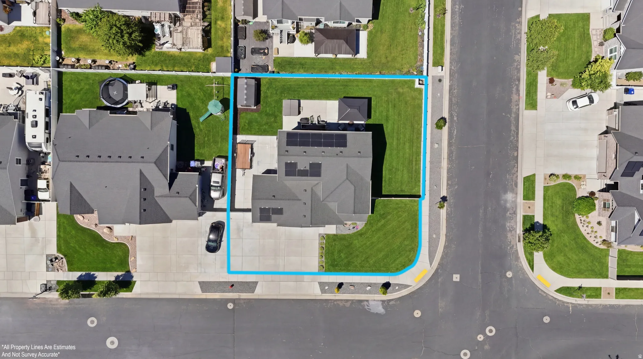 Aerial perspective showcasing a corner lot with a substantial property