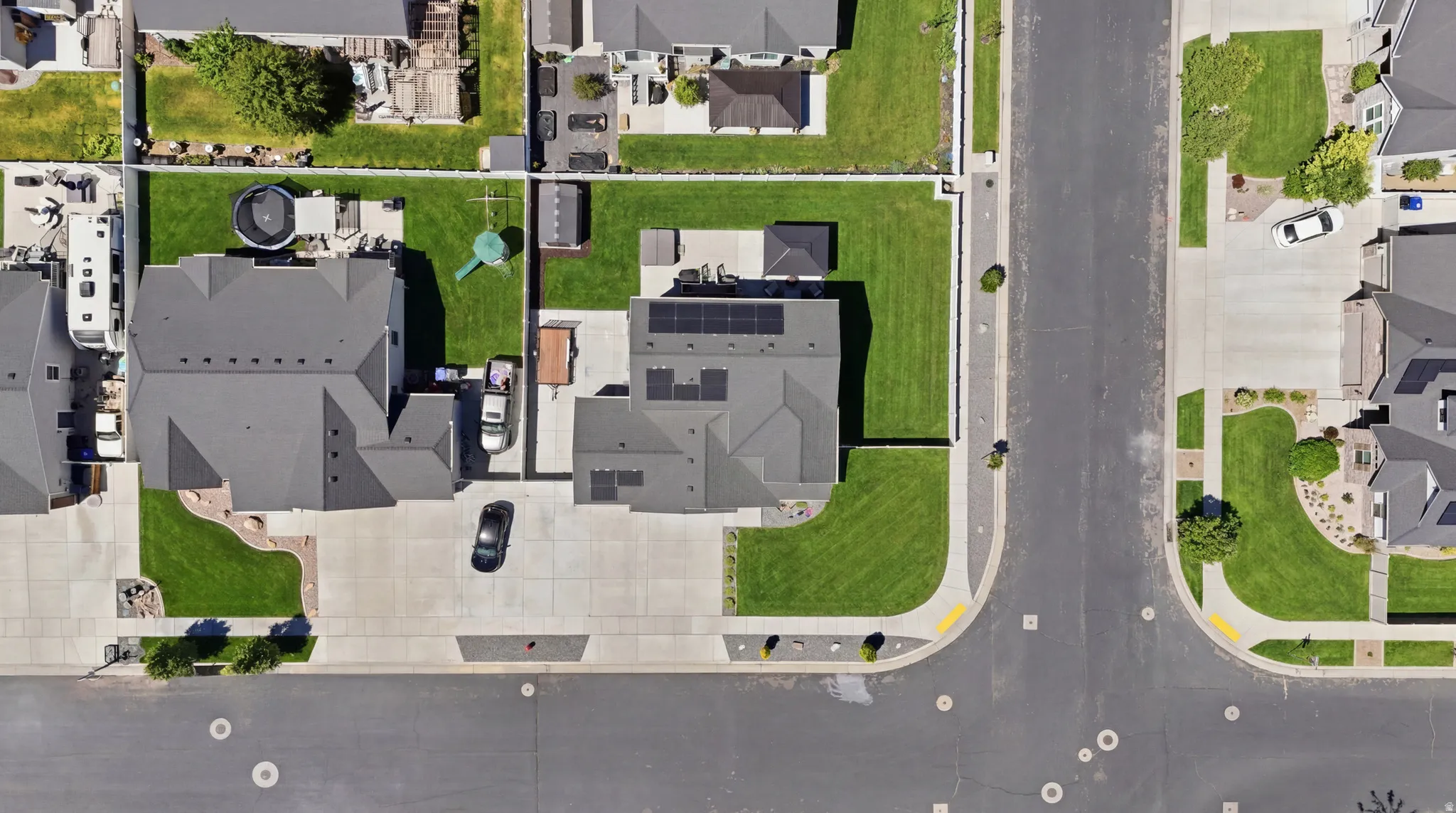 Aerial perspective showcasing a residential property with a multi-gabled roofline