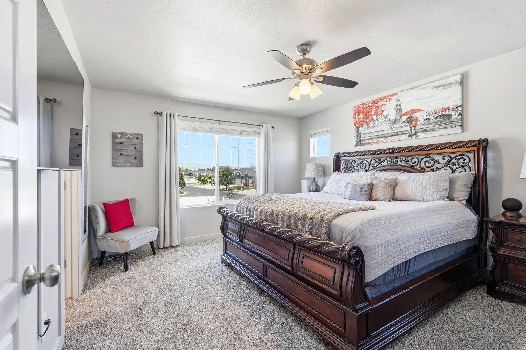 Primary bedroom featuring light gray wall paint and light carpeting