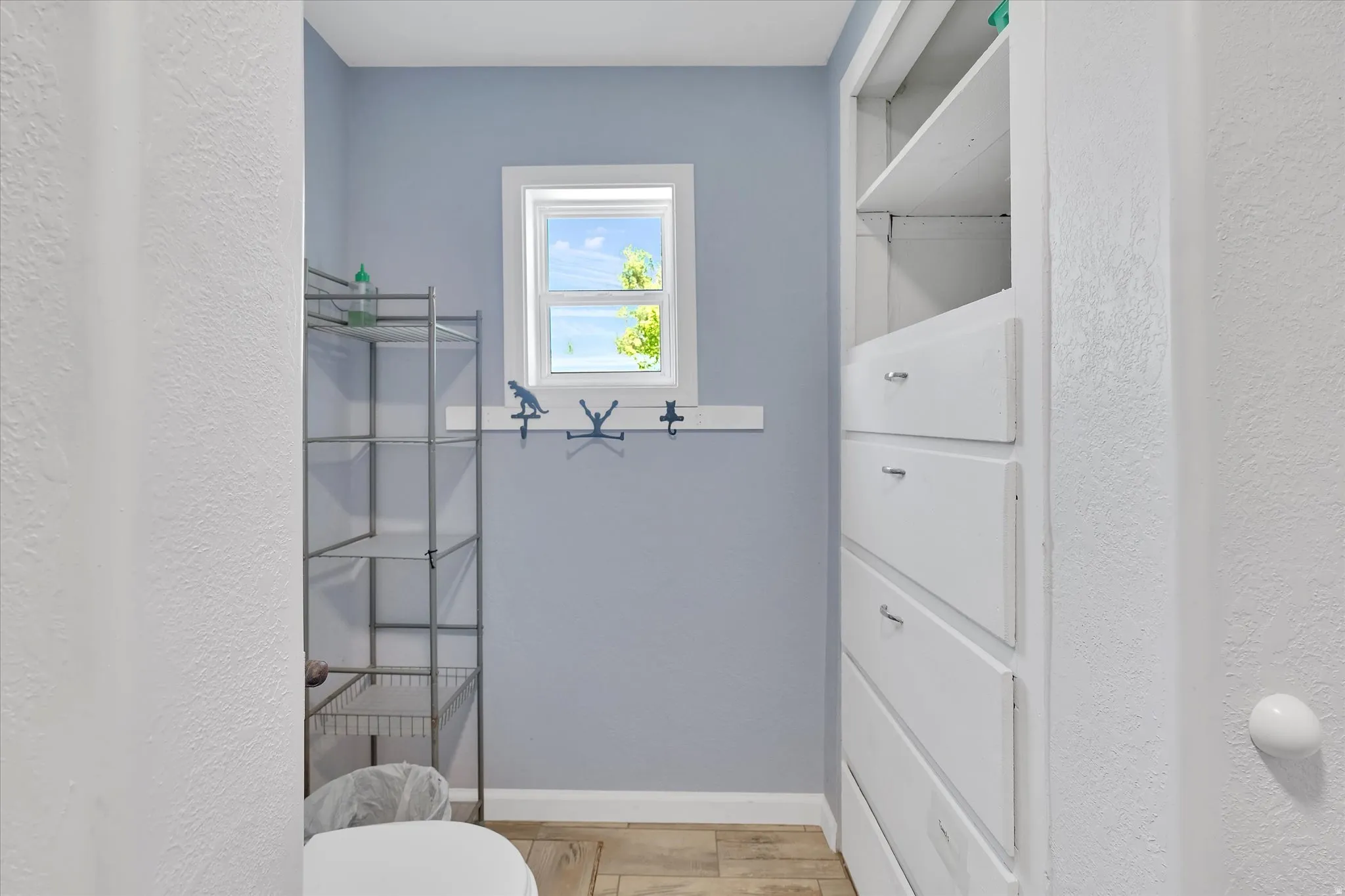 Built-in shelving and drawers provide storage solutions