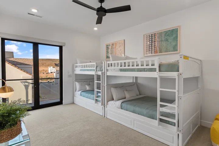 Carpeted room featuring a ceiling fan, recessed lighting, and white walls