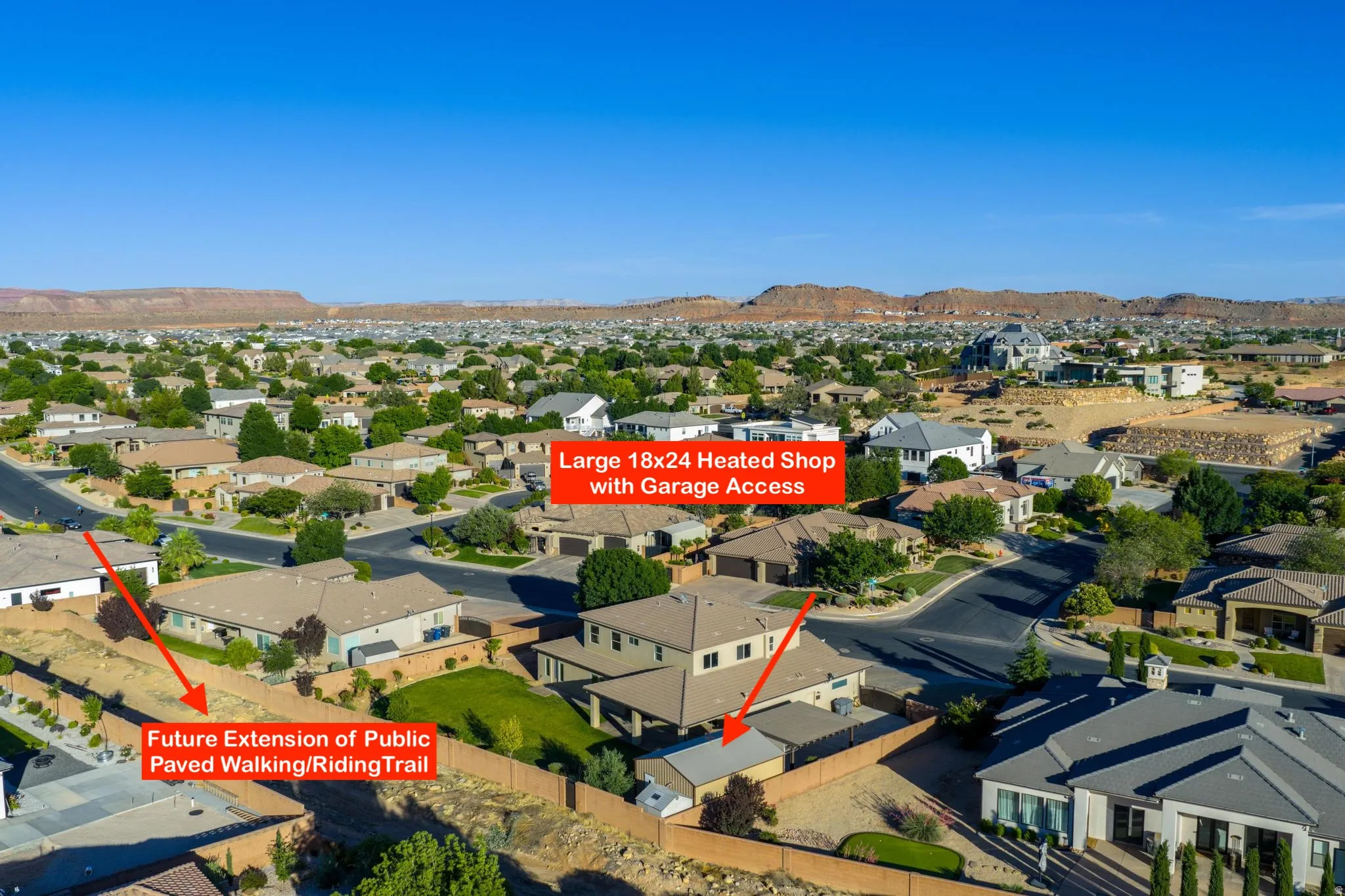 Aerial view of a residential neighborhood featuring paved streets and established landscaping