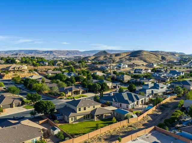 Residential area featuring a variety of architectural styles, mature landscaping, and paved streets
