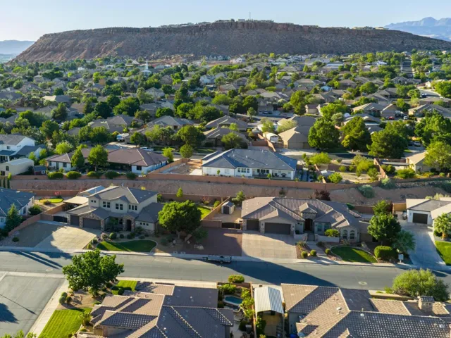 Expansive neighborhood featuring numerous residential properties with varied architectural styles, mature landscaping, and paved streets