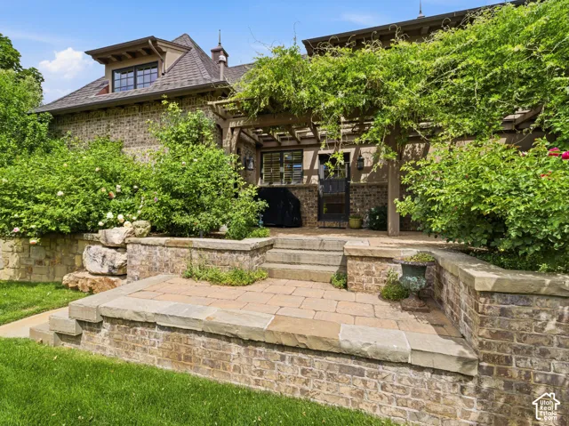 Brick exterior with stone accents and a prominent dormer window