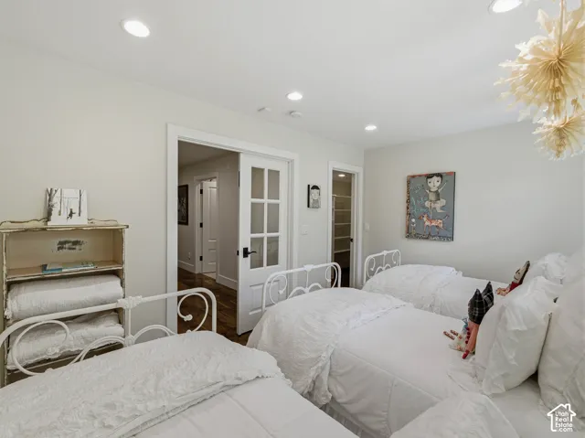 Spacious room with recessed lighting and neutral wall tones