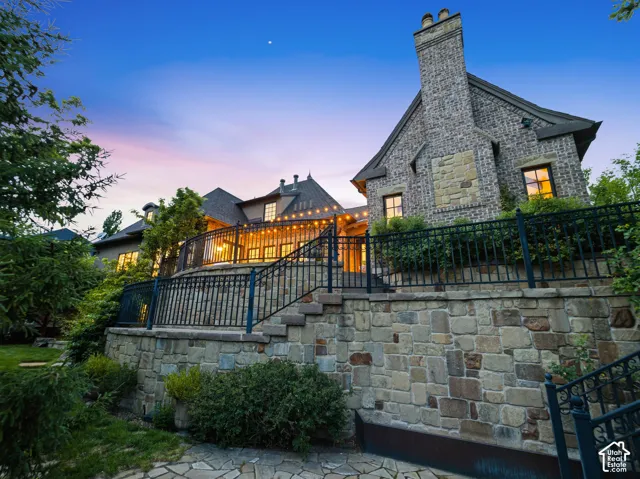 Stone and brick exterior with a prominent chimney feature